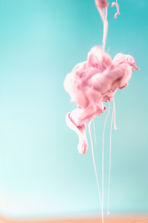 Pink ink in water, artistic shot, abstract backgroundの写真素材