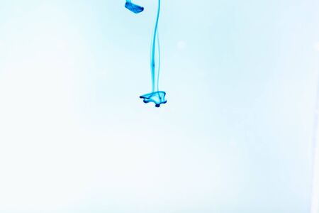 Blue ink in water, artistic shot, abstract backgroundの写真素材