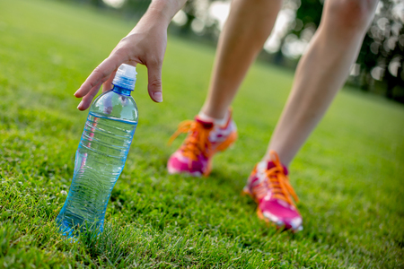 Water after running on green grass filedの写真素材