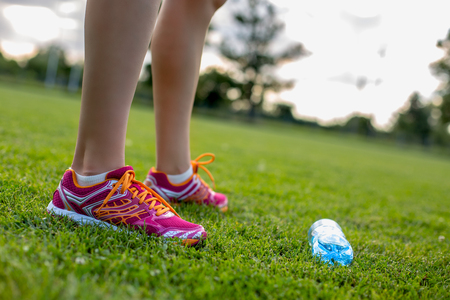 Water after running on green grass filedの写真素材