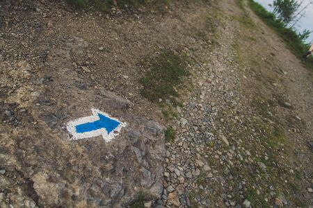 Blue trail sign on touristic wayの写真素材