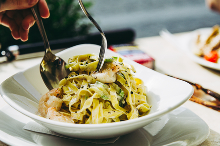 Delicious pasta carbonara, food concept on table of restaurantの写真素材
