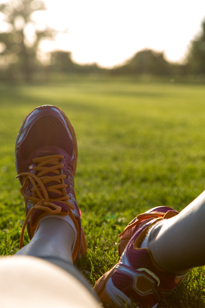Close up young girlâs shoes, training summer time conceptの写真素材
