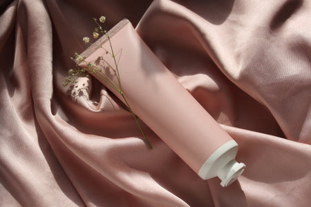 Beautiful spa composition with cosmetic products on satin background, closeup, moke up