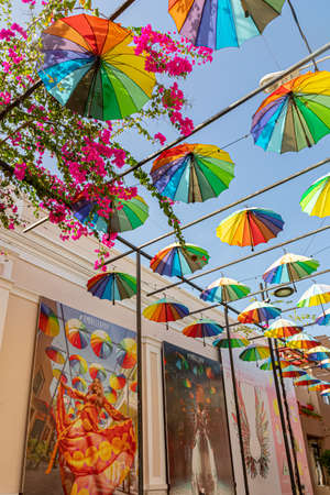 Puerto Plata, Dominican Republic - August 1, 2021: Popular attraction alley in the downtown decorated with colorful umbrellasのeditorial素材