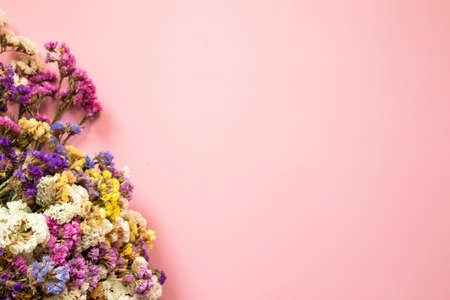 Flower composition. Frame made of dried multi-colored flowers. Flat lay, top view with place for text.の写真素材