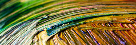 Selective focus of paint strokes. Abstract colorful background. Close-up of mixed brush strokes. Banner. Abstract ink design template mixed texture background. Mix of different color palettes.の写真素材