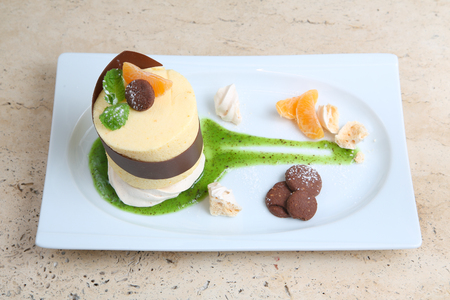Orange cake with cookiesの写真素材