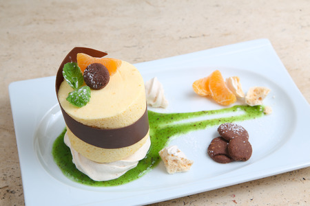 Orange cake with cookiesの写真素材