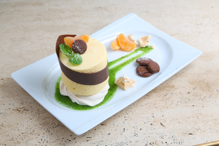 Orange cake with cookiesの写真素材