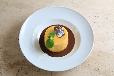 Round cake with temperate chocolateの写真素材