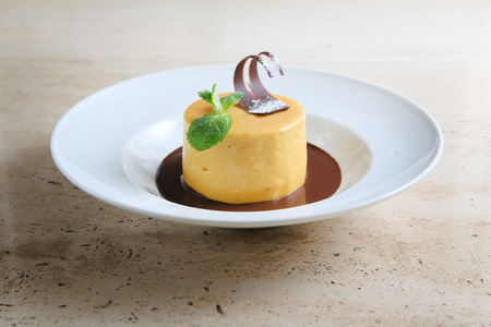 Round cake with temperate chocolateの写真素材