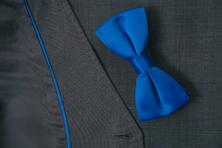 Blue bow tie on textile suit backgroundの写真素材