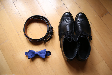 Wedding accessories: bow tie and leather shoesの写真素材