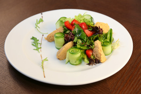 Fresh salad with chicken, tomatoes and mixed greensの写真素材