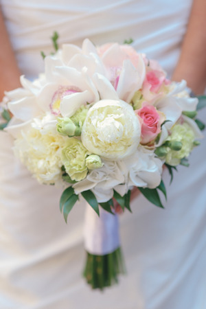 nice wedding bouquet in bride's handの写真素材