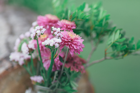 Rustic wedding photo zone. Hand made wedding decorations includes Photo Booth, wooden barrels and boxes, lanterns, suitcases and white flowersの写真素材