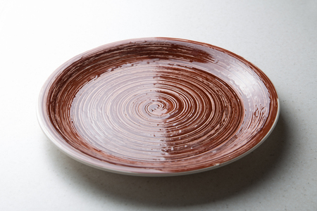 Ceramic plate isolated on white backgroundの写真素材