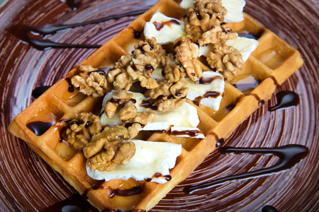 Plate of belgian waffles with cheese and nutsの写真素材