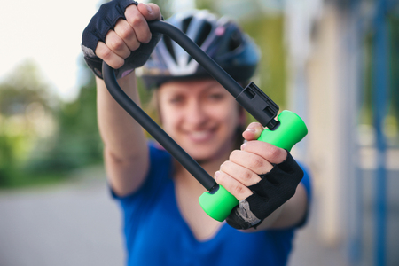 Girl with bicycle lockの写真素材