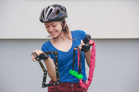 Girl with bicycle lockの写真素材