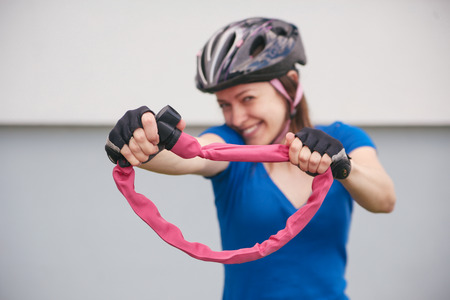 Girl with bicycle lockの写真素材