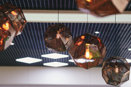 Industrial pendant lamps against rough wall. Loft interior. Edison bulbsの写真素材