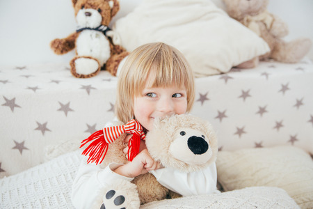 Happy little smiling child celebrates Christmas. New Year's holidays.の写真素材