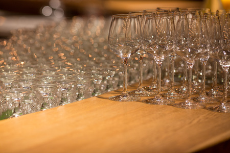 Wine glasses inwarm light loft restaurant