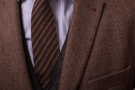 Man with retro camera in tweed vintage dressの写真素材