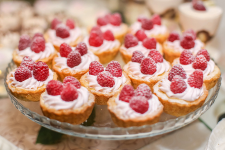 Raspberry cupcake desserts with pink creamの写真素材