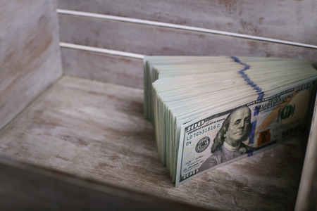 American dollar one hundred bills  in wooden boxの写真素材