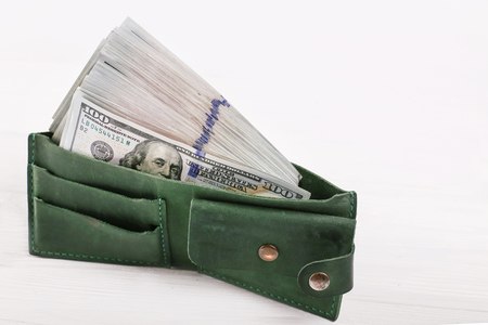 American dollar one hundred bills in green walletの写真素材