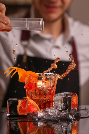 alocohol cocktail negroni on black surfaceの写真素材