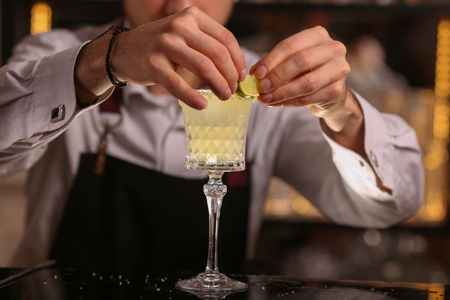 Margarita alcohol cocktail with lime ice barmenの写真素材