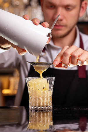 Batida cocktail drink with mint making by bartenderの写真素材