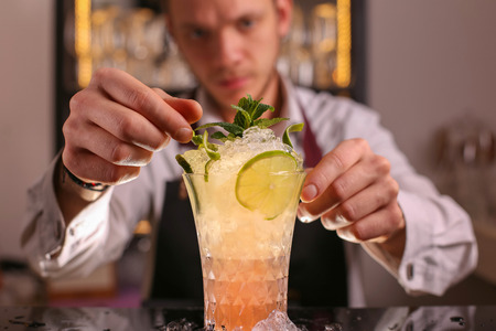 Mule alcohol cocktail drink with lime slice and mint leaves