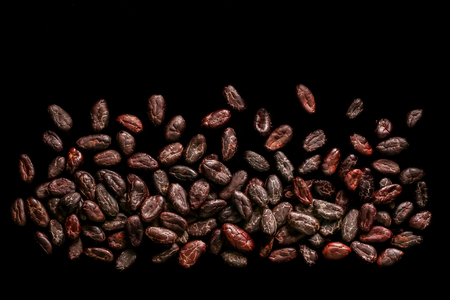 Roasted beans. Cocoa beans and coffee beans isolated on black background.の写真素材