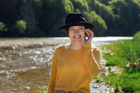 portrait of young woman traveler on natureの写真素材