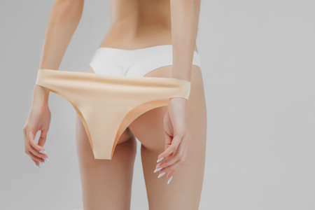 Aesthetic woman body in underwear on white background