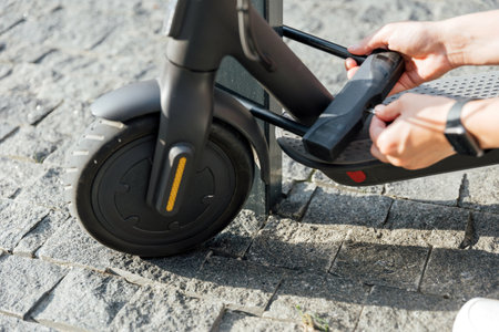 Bicycle U lock using for electric scooter to protect it from stolenの写真素材