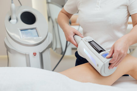 Cosmetologist using endospheres therapy machine on a femaleの写真素材