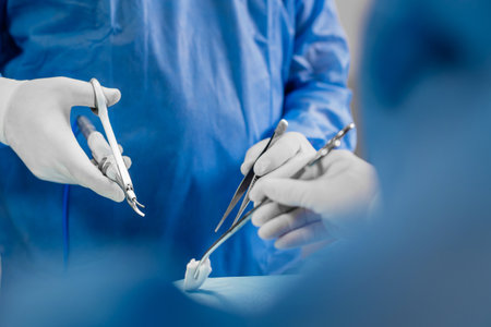 Doctor using ultrasonic surgery scissors during operation. Ultrasonic scalpel and scissor gripの写真素材