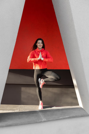 Fitness woman is fitness stretching and exercising outdoor in urban environment