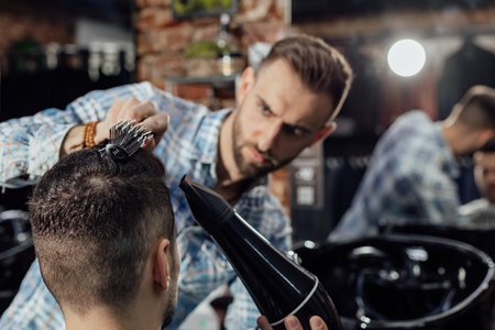 Work in the barber shop. Man hairstylistの写真素材