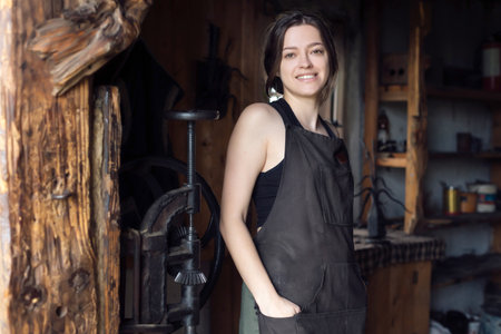 A young female entrepreneur has a small business in the production of metal craft productsの写真素材