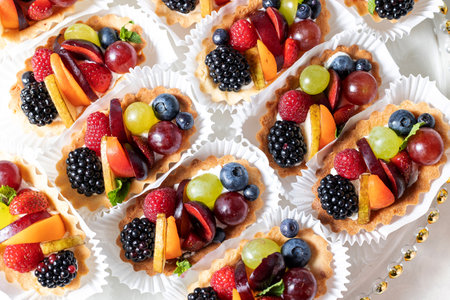 Candy bar. Festive sweet table with fruit fresh dessertsの写真素材