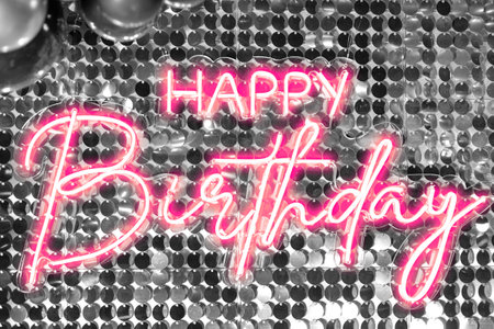 Decoration background with silver glitter and pink inscription that glowsの写真素材