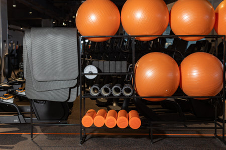 Fitness orange balls and mats in modern sports club