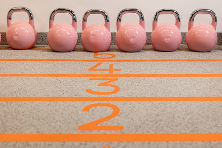 Pink Kettlebells for exercise. Sports equipment in the gymの写真素材